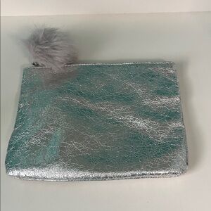 MAC Cosmetics Metallic Silver Clutch with Pom-Pom
